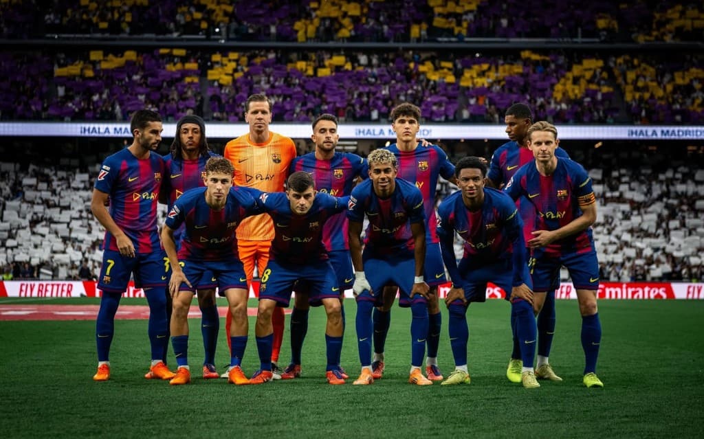 Players lined up on the pitch before a European night under a packed stadium